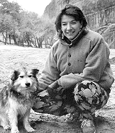 Black and white picture of Jane Larson and dog
