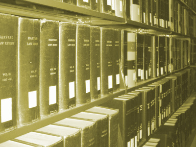 sepia-toned photo of a shelf of library books